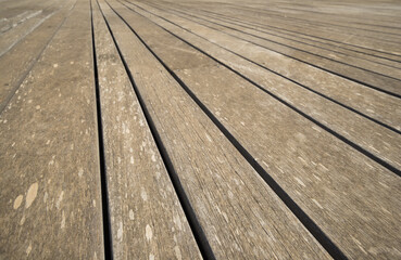 Close up of composite decking. Wood planks. Kiln dried wooden lumber texture background. Timber hardwood wall.(selective focus)