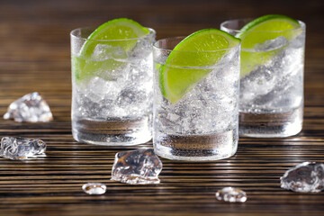 Three shots with gin and tonic