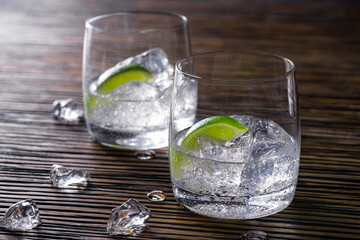 Two glasses with transparent drinks