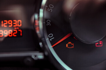 Check engine light. Car dashboard in closeup