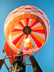 Hot air balloon with gas power accelerators, taking off