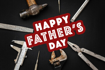 happy father's day text sign on working tools hammer wrench pliers calipers screwdriver chisel on...