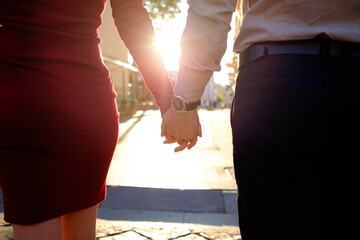 Couple holding hands each other