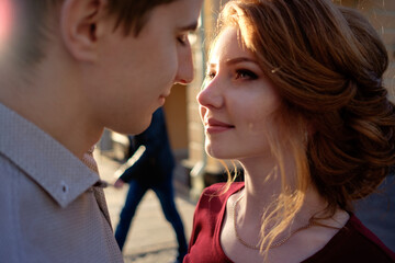 portrait of happy couple before kiss in sunset light. Love concept