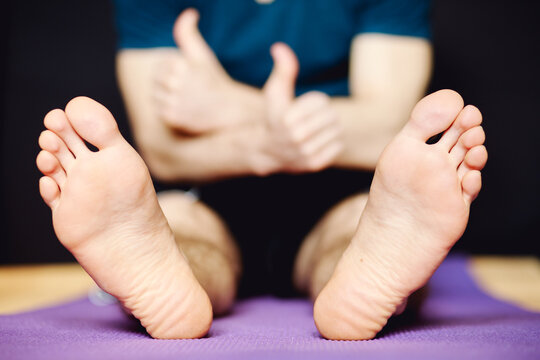 Male legs on floor mat