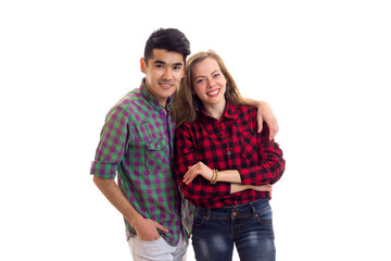 Young couple in plaid shirts