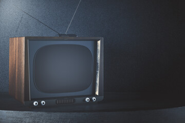 Obsolete TV on concrete background