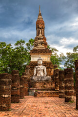 Fototapeta premium Buddha statue at Wat Tra Phang Ngoen (temple) in Sukhothai Historical Park. Thailand. Unesco World Heritage Site