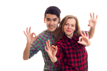 Young couple in plaid shirts