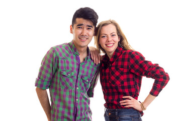 Young couple in plaid shirts