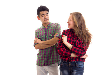 Young couple in plaid shirts