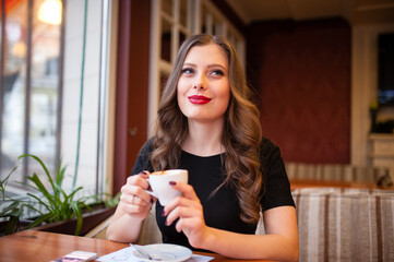 Beautiful girl drinking coffee