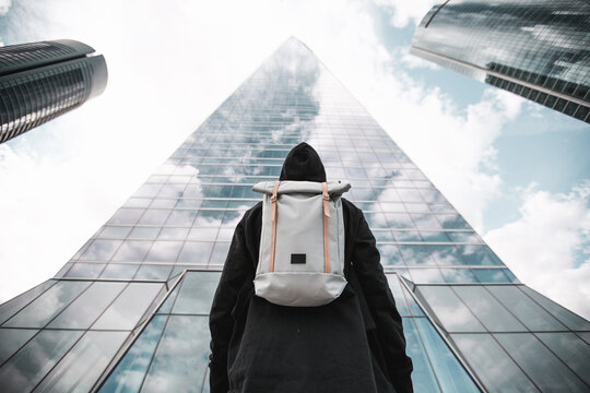 Urban Backpacker In The City With Background Buildings