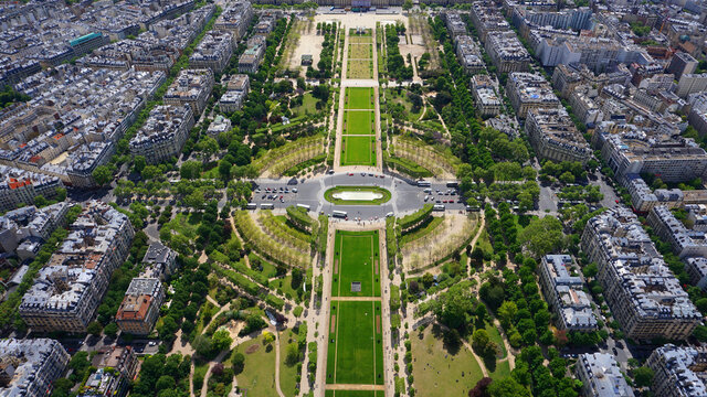 Aerial view of Champ de Mars gardens from Eiffel tower with beautiful scattered clouds, Paris, France