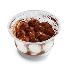 Delicate dessert from curd cream with cocoa powder in a  bowl, isolated on a white background