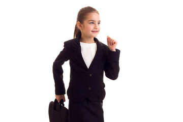 Little girl in black jacket holding diplomat 