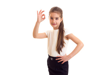 Fototapeta na wymiar Little girl in white T-shirt and black skirt