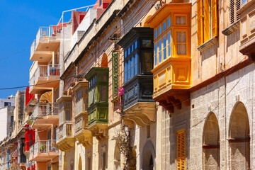 The traditional Maltese colorful wooden balconies in Sliema, Malta