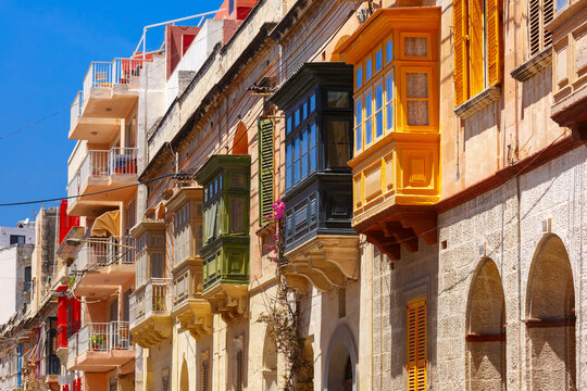 Fototapeta The traditional Maltese colorful wooden balconies in Sliema, Malta