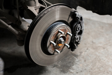 Closeup disc brake of the vehicle for repair.