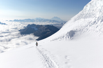 Fototapeta na wymiar Mountaineers walking climbing snow trail mountains ridge, Bolivia.