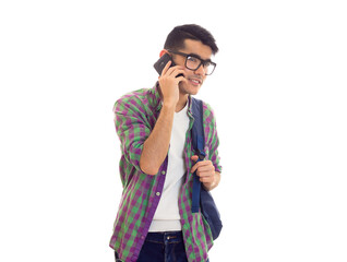 Young man with backpack and smartphone 