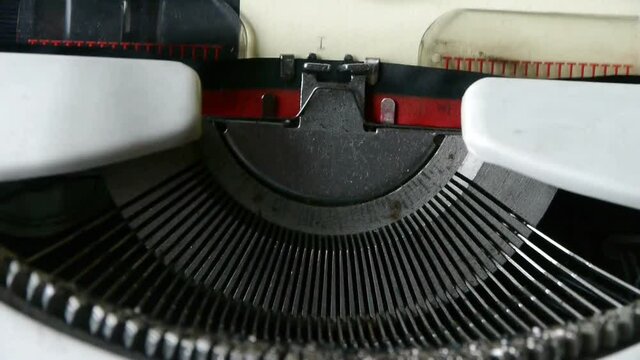 Hands typing on a typewriter to play the characters I love you.