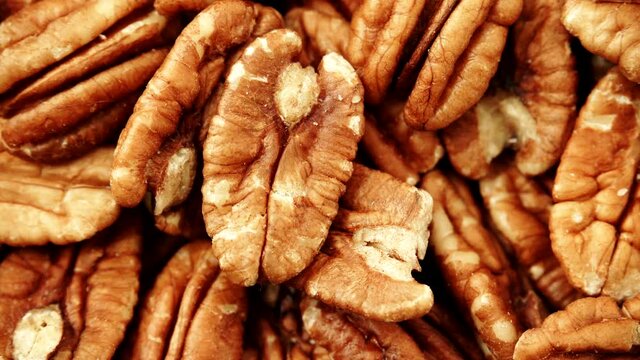 Food background. Pecan nuts close up. Dieting concept. Rack focus 4K ProRes HQ codec