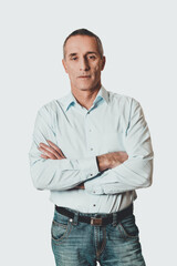 Portrait of handsome man with folded arms