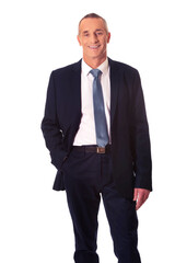 Smiling businessman with hand in pocket