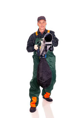 Worker in uniform with a leaf blower