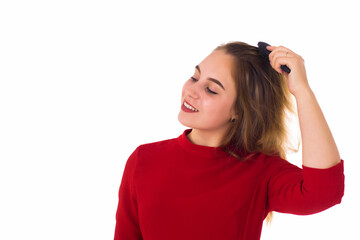 Fototapeta premium Young pretty woman, hairbrush, white background 