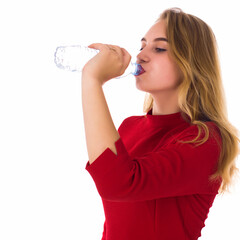 Young pretty girl drinks fresh water  