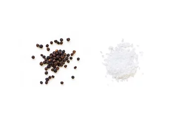 Poster Dried whole seed of black pepper and white coarse sea salt isolated on a white background seen from above © ydumortier