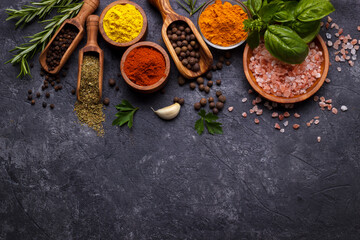 Obraz na płótnie Canvas Herbs and spices over black