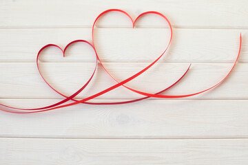 Valentines day card - heart made of ribbon on white background