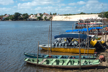 Tourist boats waiting for tourists on the river Rio Preguica, Barreirinhas, Lencois Maranhenses National Park, northern Brazil