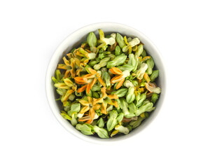 Cowslip creeper flower in white ceramic bowl on white background