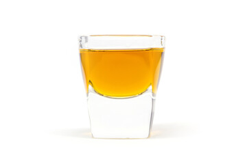 Whiskey shot on white background.