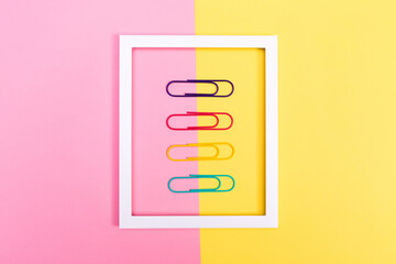 Big paper clips on a vibrant background