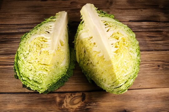 Savoy cabbage on wooden table