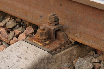 iron mounts to the rail on the railroad close up