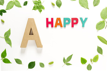 Letter A and Happy with green leaves