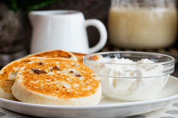 Cheesecakes for breakfast on a dark wooden background