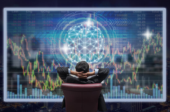 Back side of sitting businessman who is looking at the technology digital virtual screen over the cityscape and brain shape and trading graph background, Business and technology concept - Powered by Adobe