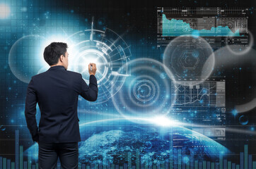 Businessman writing the modern virtual screen over the earth planet with star and trading graph background, Elements of this image furnished by NASA, Business and technology concept