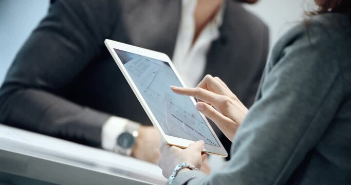 Businesswoman using tablet pc at work in office