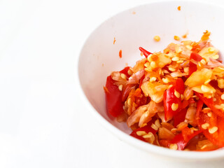 Red Chili crushed and chooped in a white bowl