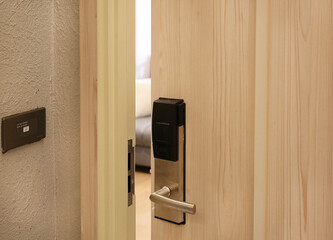 Obraz premium Half open door of hotel room.