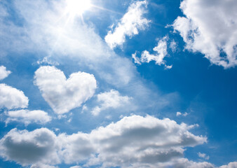 Plakat heart shape cloud in blue sky background with space for text